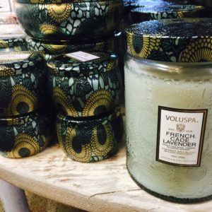 Close-up of candles in shiny, fancy jars from Sunset Ridge.