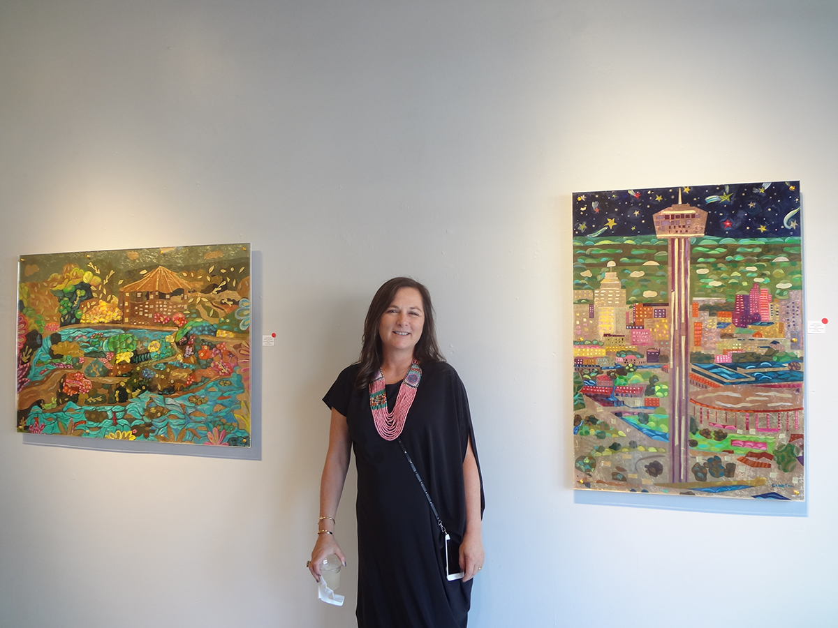 Artist Brook Rosser with two of her paintings Tower of America and Japanese Tea Garden