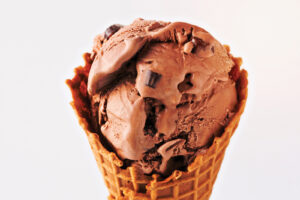 Chocolate Ice Cream With Chocolate Pieces In A Waffle Cone